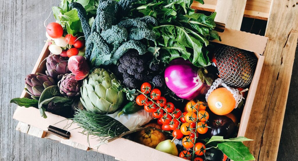 Our produce banner image section showing beautiful in season vegetables